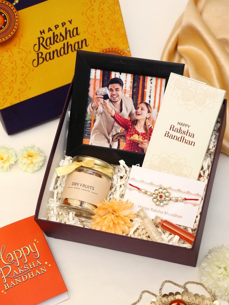 Send AD Bhaiya Bhabhi Rakhi with Cookies N Clock Gift Combo Online